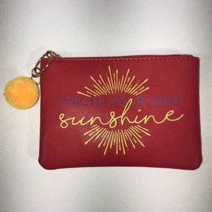 Free w/ $25 Purchase Mini Zippy Pouch with Pom-Pom